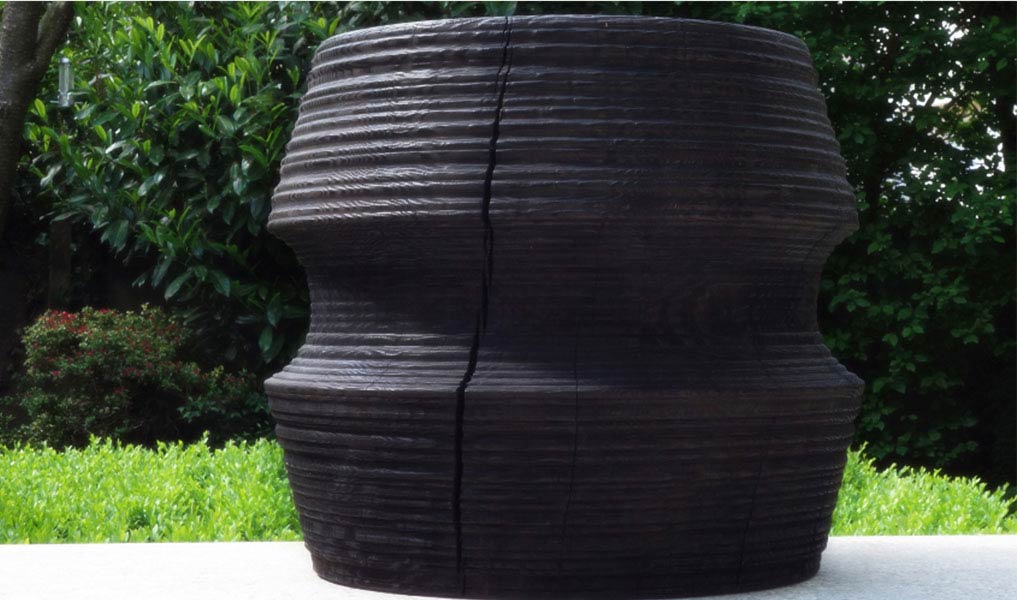 Handmade side table in burnt wood, matte black finish | Human Heritage